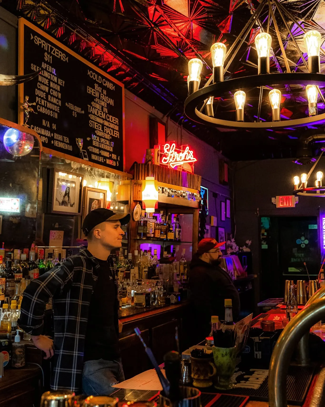 A busy night at the bar under neon lights